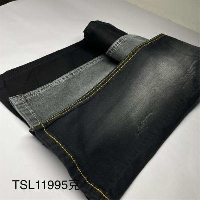 中国 ODMのマイクロ羊毛は黒いジーンズの冬のジャケットのための物質的なデニムの生地を並べた 販売のため