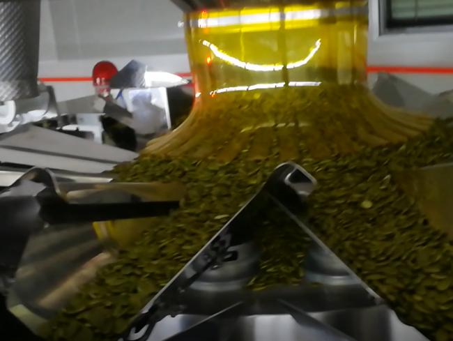 Intelligent dry snack food packaging machine with stainless steel construction