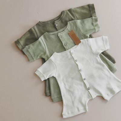 China Unisex 100% Cotton Baby New Born Rompers Ribbed Button Jumpsuit With Light Color for sale