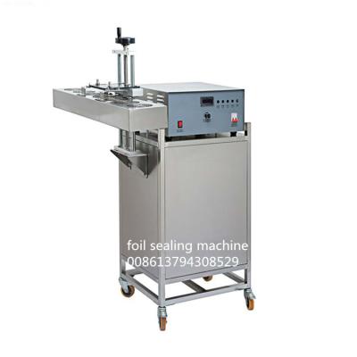 China Continuous Electromagnetic Induction Aluminum Foil Sealing Machine for sale