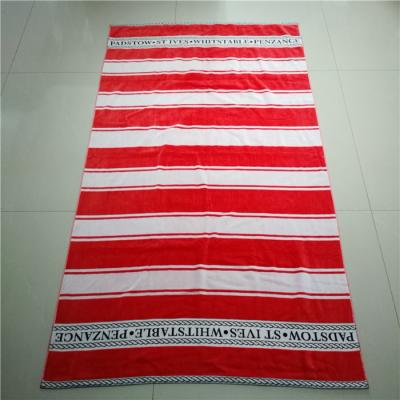China 100% cotton velour woven jacquard custom logo beach towel for sale
