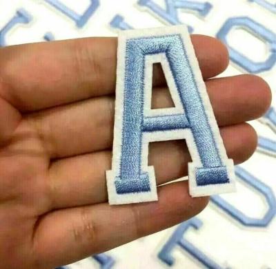 China Baby Blue Embroidered Letter Patches Twill Fabric Retro Alphabet For Clothes en venta