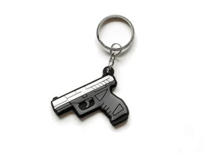 China Custom Logo Mini Key Chains Silicone Toy Gun Soft PVC Keychain for sale