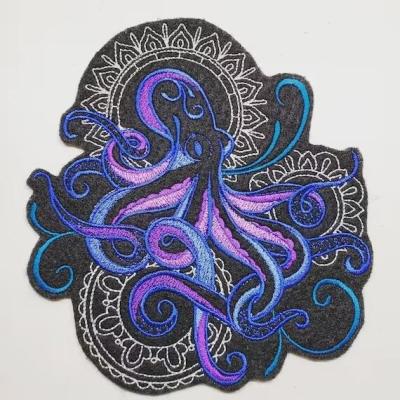 China Custom Octopus Embroidered Patch Blue Merrow Border Embroidery Designs for sale