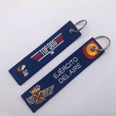 China Custom Embroidery Key Chains Printed Remove Before Flight Keychain for sale