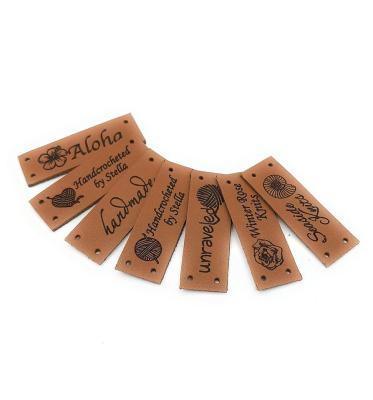 China Embossed Sew On Backing Personalised Leather Craft Labels For Clothing for sale