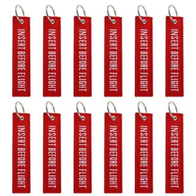 China Small ODM Flight Tag Keychain Custom Portable Red Embroidered Bulk Packaging for sale