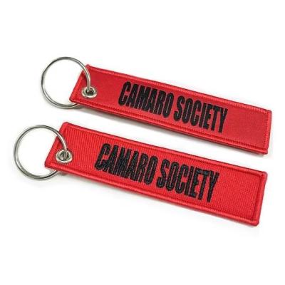 China Bulk Packaging Embroidered Keychain Custom Remove Before Flight Keychain for sale