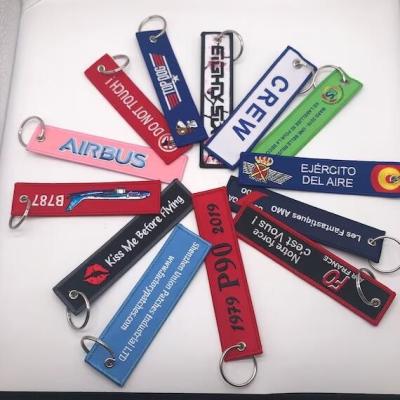 China Personalized Airplane Aviation Tags Key Chain Fabric Custom Woven Embroidery Keychain for sale