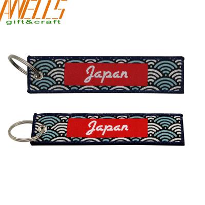 China Airplane Souvenir Custom Woven Keychain Colorful Embroidered Key Tags for sale