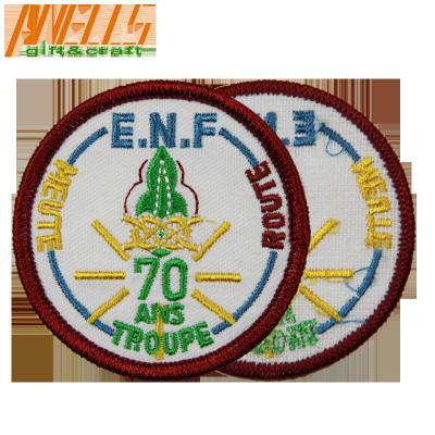 China Merrow Border Custom Iron On Embroidery Patch Twill Fabric Background For Clothing for sale