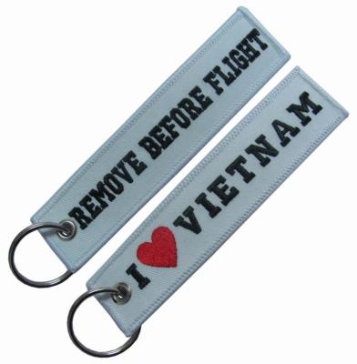 China Remove Before Flight Embroidered Keychains With Eyelet Ring for sale