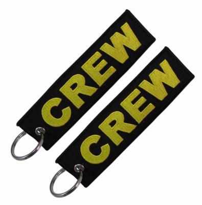 China Double Sided Remove Before Flight Keychain Twill Embroidery Textile for sale