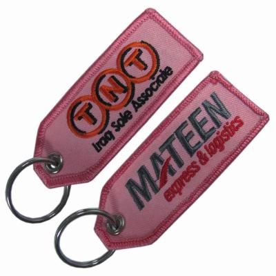 China PMS Twill Felt Embroidered Keychain Embossed Merrow Border Hang Tag 130×30mm for sale