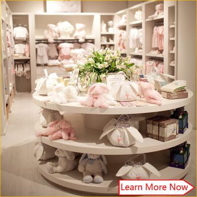 China Customized high quality baby kids clothes store interior design en venta