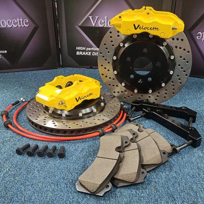 China Big Brake Kit Customized Color 4 Piston Brake Caliper Slotted Or Drilled Discs for sale