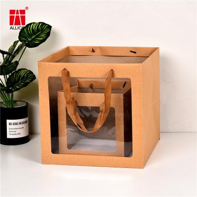China Custom Printed Black White Luxury Shopping Gift Paper Bag With Handle for sale