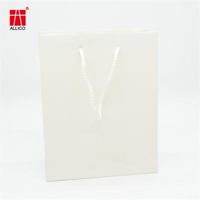 China Custom Logo Gift Bag Glossy Clothes Retail Shopping Paper Bags With Rope Handles for sale