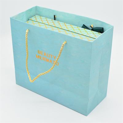 China CMYK Printing Cosmetic Shopping Bag , 140g Makeup Paper Bag for sale