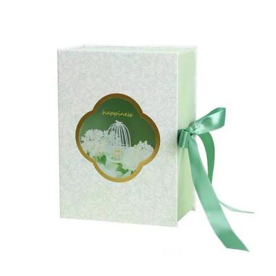 China Green Folded Book Carboard Boxes With Ribbon Transparent Window For Perfume Gift Packaging for sale