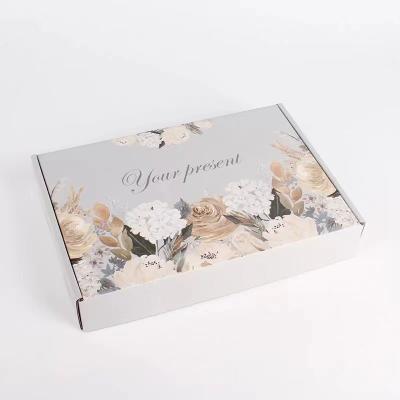 China CMYK E Flute Luxury Clothing Packaging Boxes With Flowers Design for sale