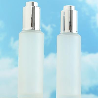 China 30ml Clear Frosted Glass Bottle Cosmetic Bottle Packaging With Pressure Dropper for sale