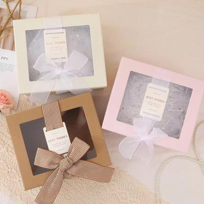 China Ribbon White Cardboard Cosmetic Box With PVC Window Cosmetic Paper Box Packaging for sale