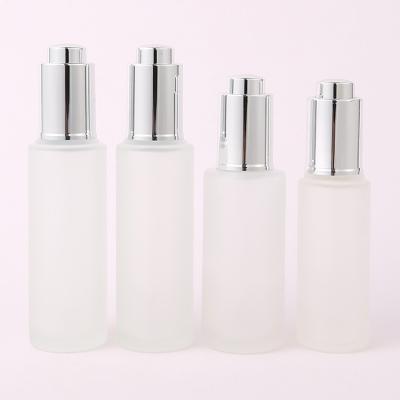 China 30ml Custom Clear frosted glass bottle With Pressure Dropper Cosmetic Skincare for sale
