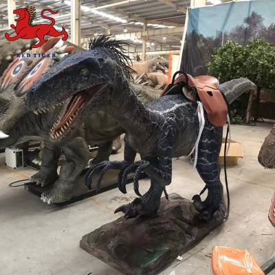 China Cabeza de dinosaurio Raptor decorativa montada en la pared para sala de Escape de dinosaurio animatrónico realista de alta calidad en venta