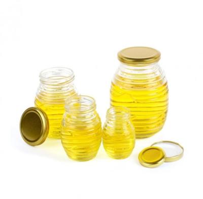 China Customized Logo Glass Jar Professional Honeycomb Thread Shape Glass Jar for sale