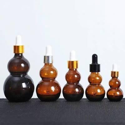 China Durable Cosmetic Glass Bottle empty Gourd Shaped Dropper Bottle for sale