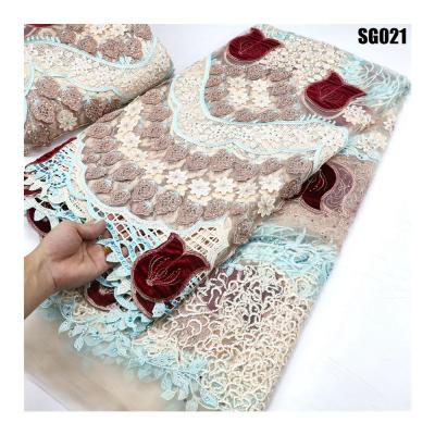 China Newest african tulle lace with special flowers embroidered and stones tulle lace fabric for the wedding party for sale
