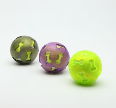 China Cute Bone Hollow Plastic Balls With Toys Inside 53g BSCI Certification for sale