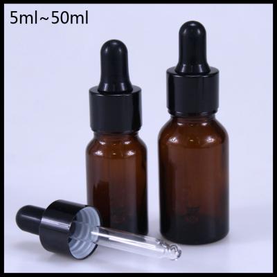 China Durable Amber Essential Oil Glass Bottles Black Aluminum Screw Cap Round Shape for sale