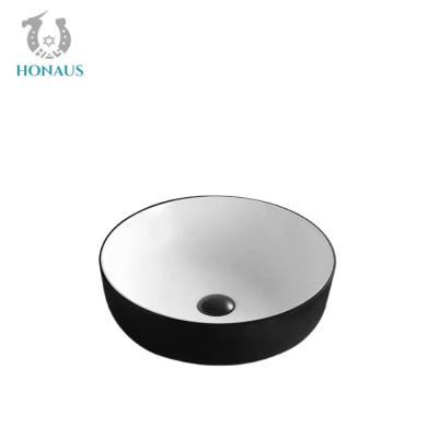 中国 Ceramic Glazed Bathroom Countertop Basin Round Shaped Hand Wash Basin 販売のため