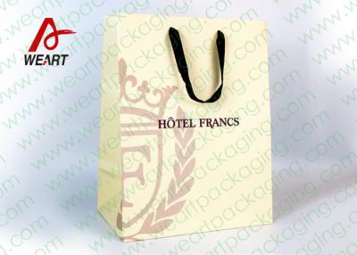 China Customized Art Paper Bags , Surface UV Spoting Sturdy Gift Bags With Cotton Ribbon for sale