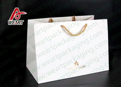 China Hot Foil Stamping Christmas Gift Custom Printed Paper Bags Eco Friendly Feature for sale