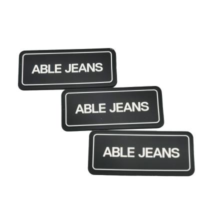 China Factory Direct Sales Straight Cut Durable Soft Custom Embossed Jeans Silicone Labels For Clothing for sale