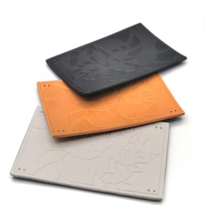 China Short Delivery Time Black White Orange Color Deboss Jeans Patch PU Leather Cloth Labels For Garments zu verkaufen