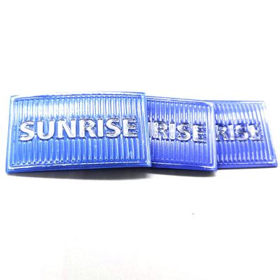 China TPU Clothing Brand Tags Blue Stripe Embossed Custom Logo Silicon for sale