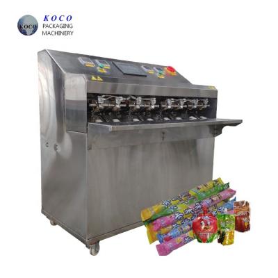 China KOCO Máquina semiautomática de llenado y sellado de bolsas de jugo de frutas, máquina de envasado de bolsas pequeñas en venta