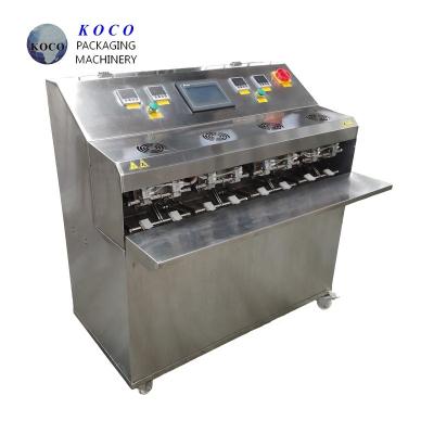 Китай KOCO Небольшая машина для розлива жидкостей Полуавтоматическая система розлива Технология горячего запечатывания продается