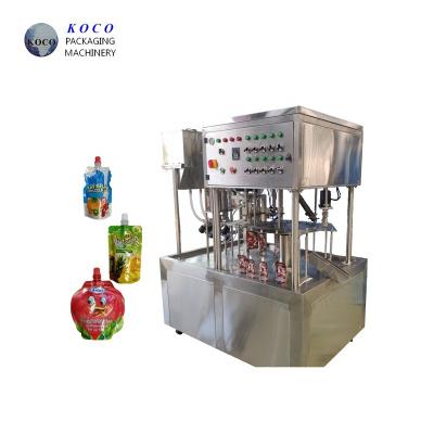 China KOCO Suction nozzle beverage bag filling and capping machine Standing plastic bag for sale