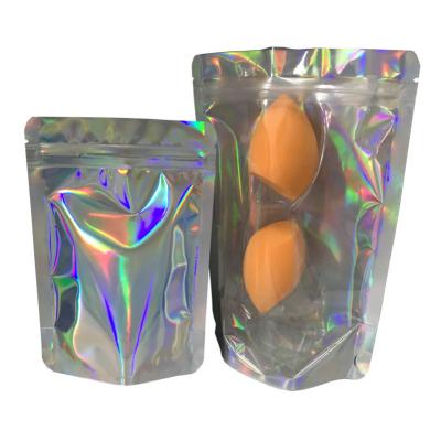China Front clear Mylar Holographic Packaging Bag for Cosmetics Beauty Sponge Packaging for sale