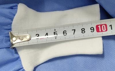 China Knitted Cuff Disposable Hospital Gowns , Surgical Gowns Hook Loop Fastener for sale