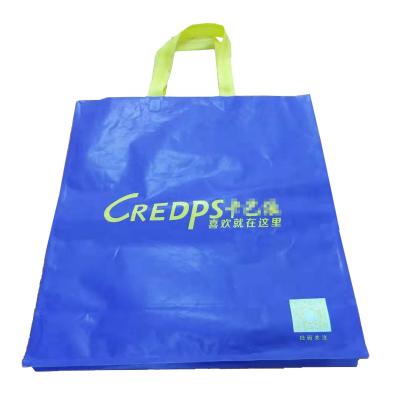 China Mylar Lamination Gift Packaging Bag 10kgs Custom Shopping Bag With Carry Rope for sale