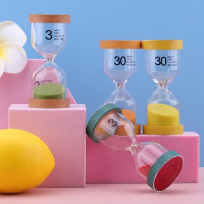中国 Home Decor Resin Yoga Hourglass Shaped Fruit Mini Hourglass Timer 販売のため