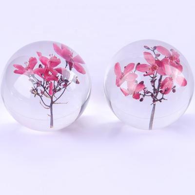 China Artificial Transparent Paperweight , Clear Epoxy Resin Ball With Real Dry Flower Inside for sale