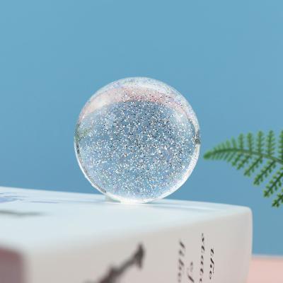Chine Métier en cristal à la maison brillant la boule de cristal claire des boules 50mm de scintillement de poudre de boule UV acrylique de jouets à vendre