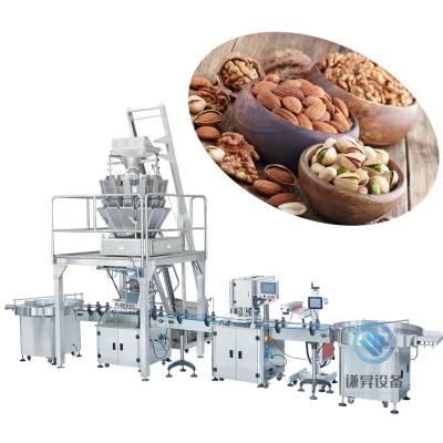 China Automatic weighing filling and sealing packaging machine for dry fruit and nut packing line for sale